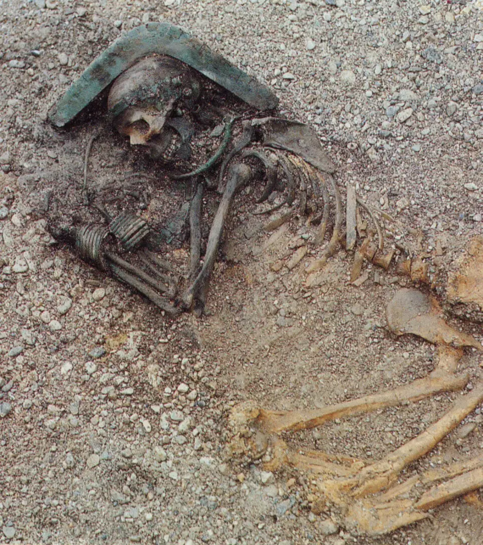 Breaking News: 4,000-year-old woman with intricate bronze ornaments and unique headdress discovered.
