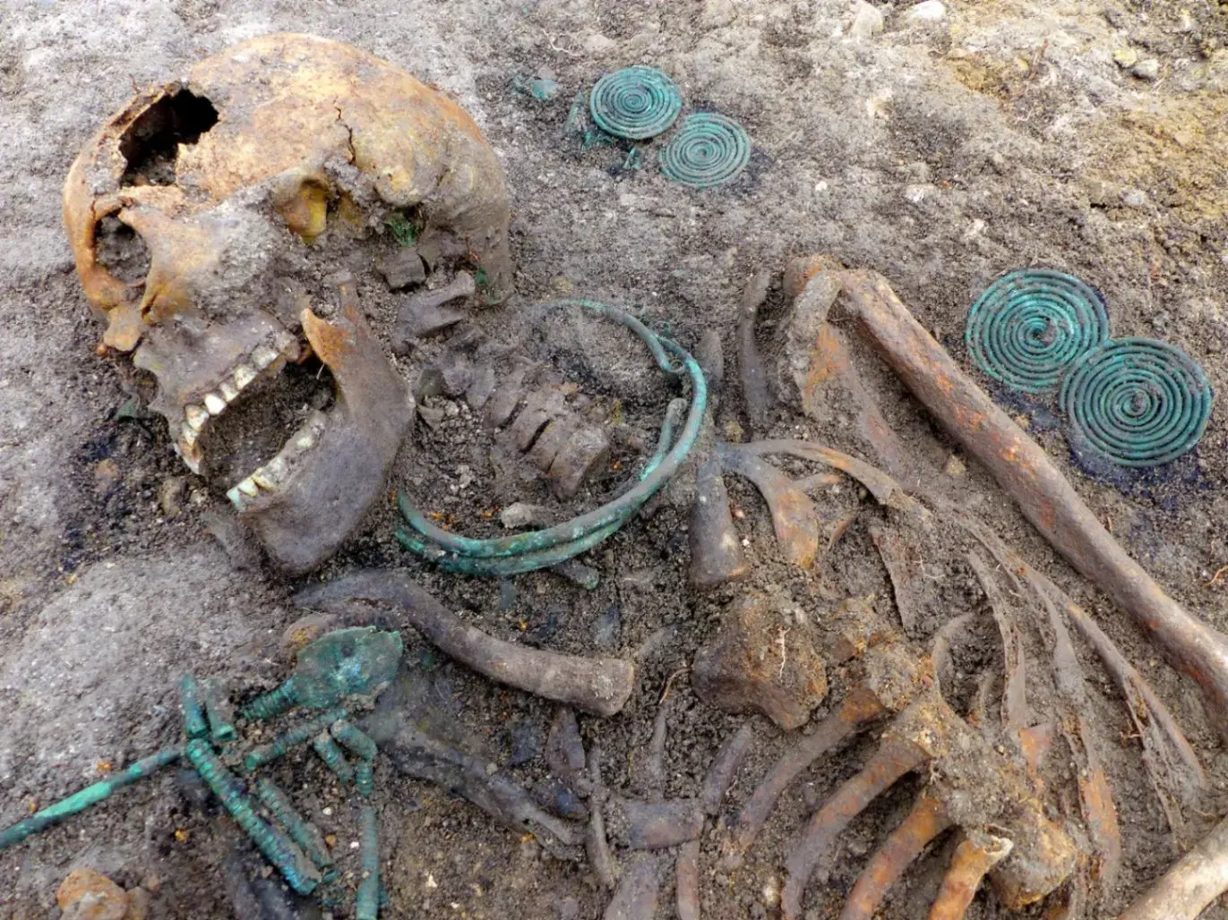 Breaking News: 4,000-year-old woman with intricate bronze ornaments and unique headdress discovered.