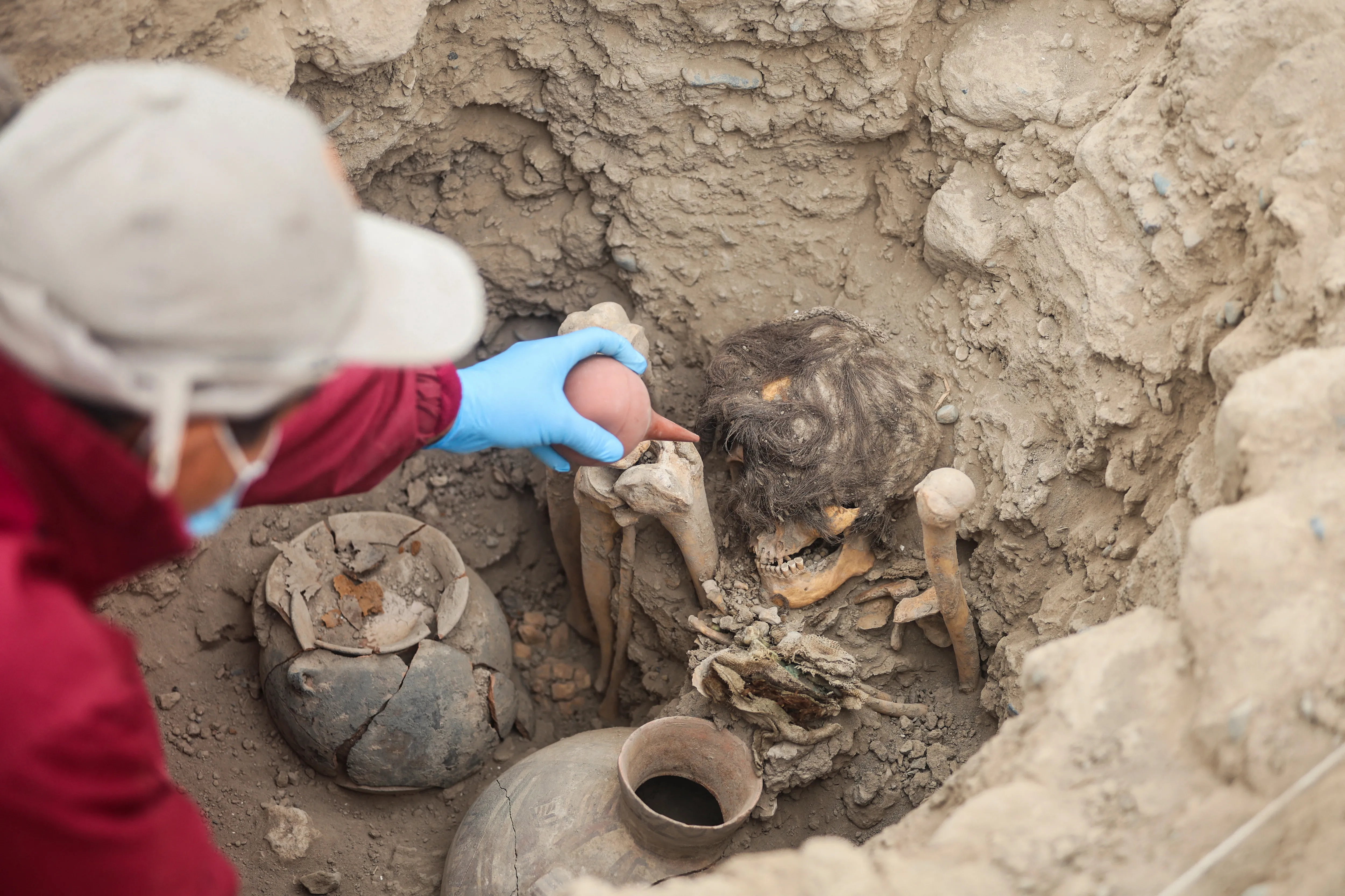 Peruvian archaeologists unearth extraordinary thousand-year-old mummy of a teenager