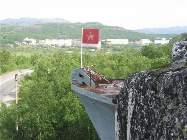 A Russian naval ship appears to be embedded in a stone mountain in Murmansk, Russia.